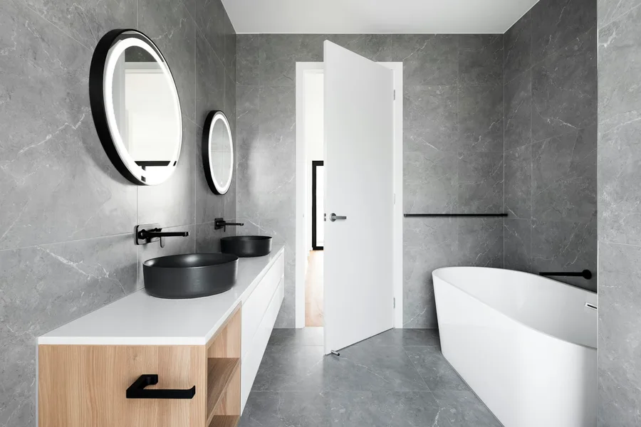 Contemporary shower room with glass screen and stone-effect finishes